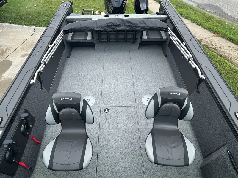 Slide: The Image of 2026 Lund 2075 Fisherman boat interior with two seats and spacious deck. - 13