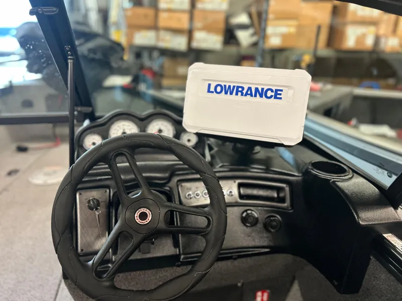 Slide: The Image of 2026 Lund 2075 Fisherman boat dashboard with Lowrance navigation system. - 14