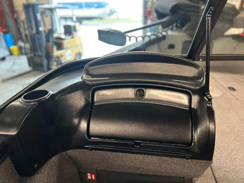 Slide: The Image of 2026 Lund 2075 Fisherman boat dashboard with storage compartment and cup holder. - 15