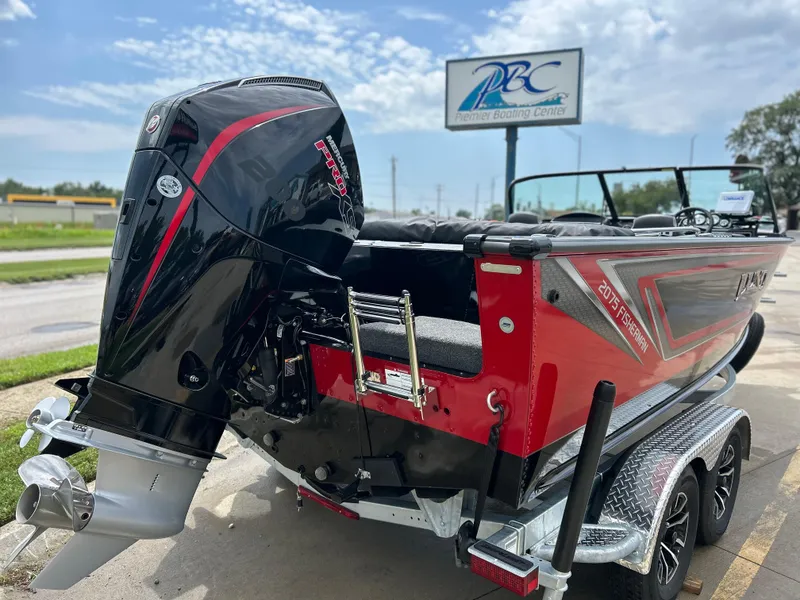 Slide: The Image of 2026 Lund 2075 Fisherman boat with powerful outboard motor at Premier Boating Center. - 4
