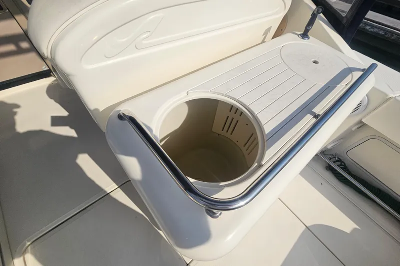 Slide: The Image of 2001 Sea Ray 290 Amberjack boat interior with built-in storage compartment. - 12
