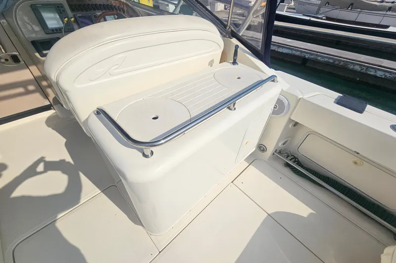 Slide: The Image of 2001 Sea Ray 290 Amberjack boat interior with seating and control panel. - 13