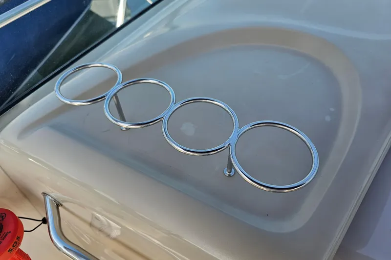 Slide: The Image of Chrome cup holders on 2001 Sea Ray 290 Amberjack boat deck. - 16