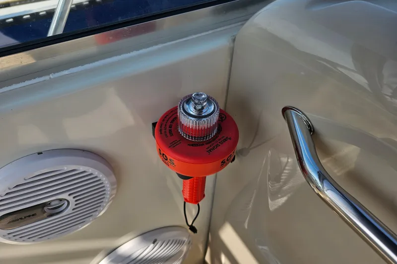 Slide: The Image of Safety equipment on 2001 Sea Ray 290 Amberjack boat, featuring SOS distress light and Alpine speaker. - 17