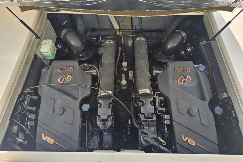 Slide: The Image of Engine compartment of a 2001 Sea Ray 290 Amberjack with twin V8 engines. - 27
