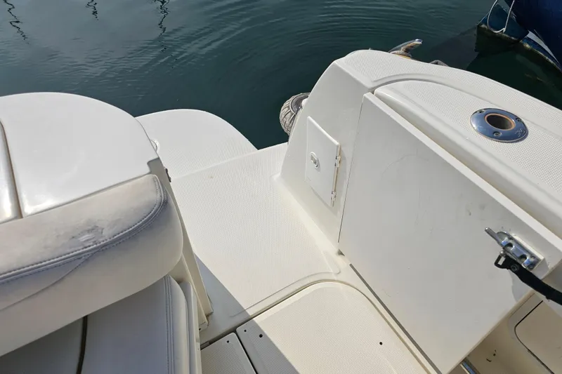 Slide: The Image of 2001 Sea Ray 290 Amberjack boat deck with seating and storage compartments. - 8