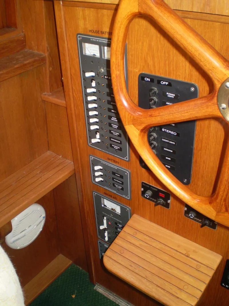 Slide: The Image of Wooden helm and control panel of 2001 Maple Bay 32' Trawler. - 16