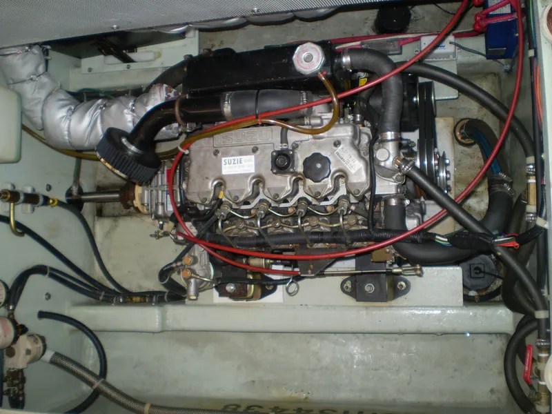 Slide: The Image of Engine compartment of a 2001 Maple Bay 32' Trawler, showcasing detailed mechanical components. - 24