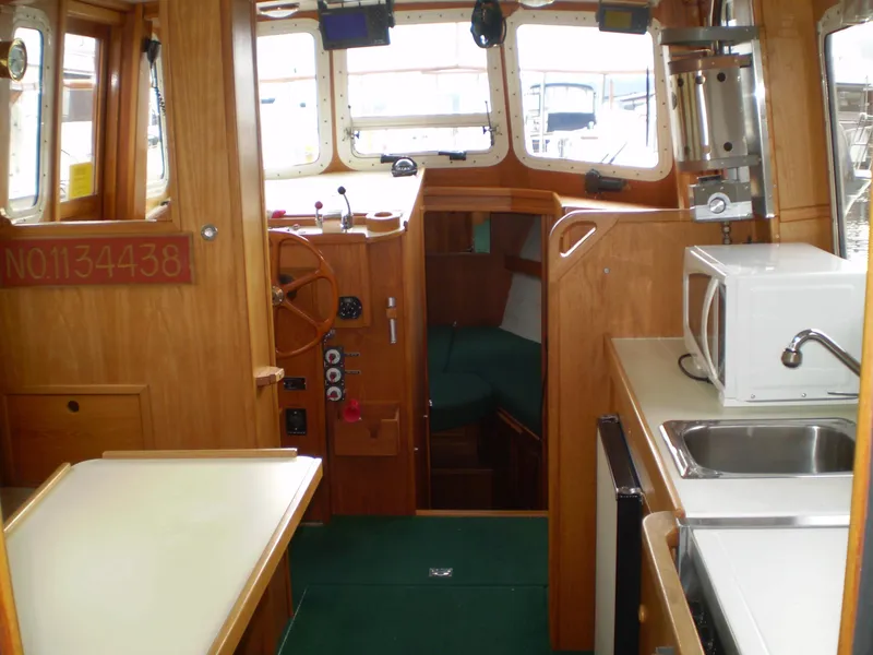 Slide: The Image of Interior of 2001 Maple Bay 32' Trawler with kitchen and helm station. - 7