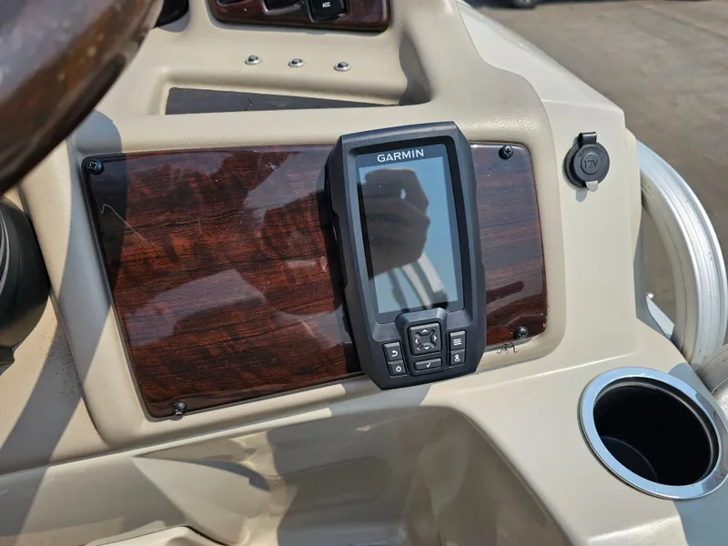 Slide: The Image of Dashboard of 2014 Bennington 2275 GL with Garmin GPS and cup holder. - 13