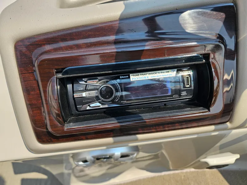Slide: The Image of Sony stereo system in a 2014 Bennington 2275 GL boat dashboard. - 14