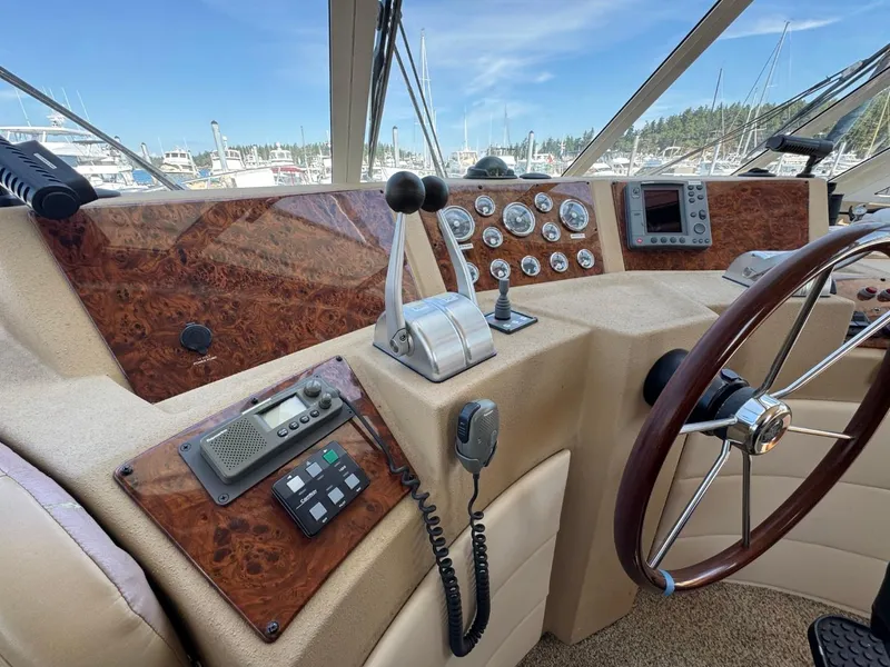 Slide: The Image of 2003 Meridian 490 Pilothouse Motor Yacht helm with controls and navigation instruments. - 20