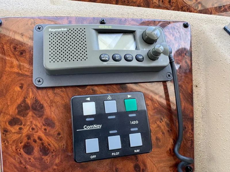 Slide: The Image of Control panel of a 2003 Meridian 490 Pilothouse Motor Yacht with Raymarine and ComNav equipment. - 21
