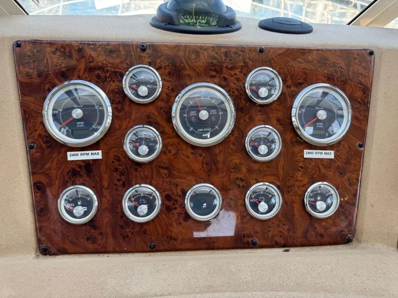 Slide: The Image of Instrument panel of 2003 Meridian 490 Pilothouse Motor Yacht with multiple gauges. - 23