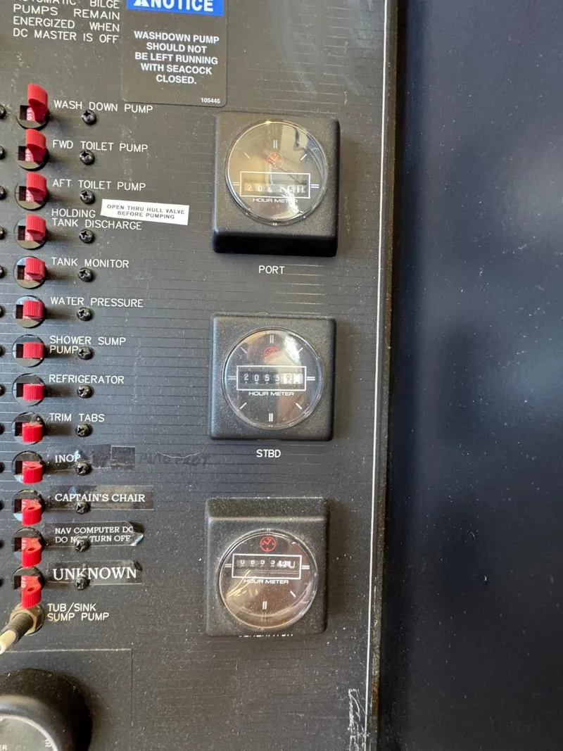 Slide: The Image of Control panel of a 2003 Meridian 490 Pilothouse Motor Yacht with hour meters. - 29