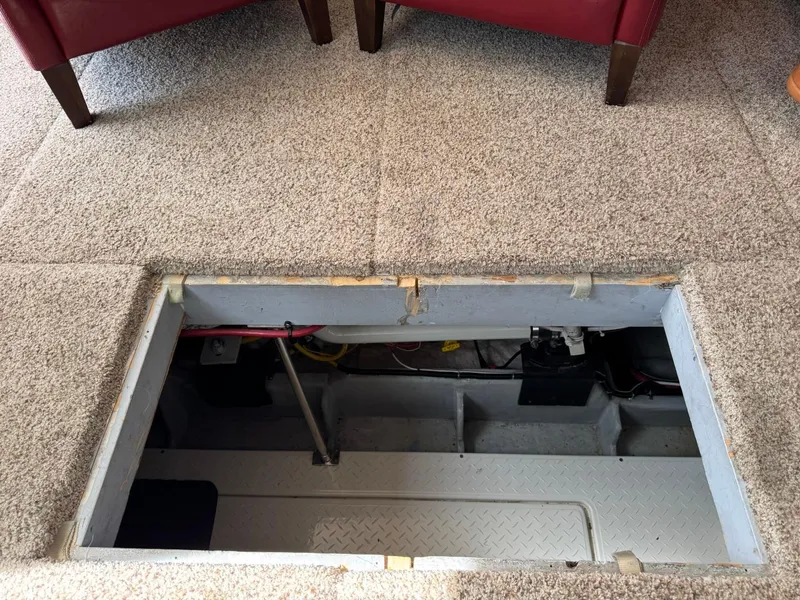 Slide: The Image of Open hatch in carpeted floor of 2003 Meridian 490 Pilothouse Motor Yacht. - 32