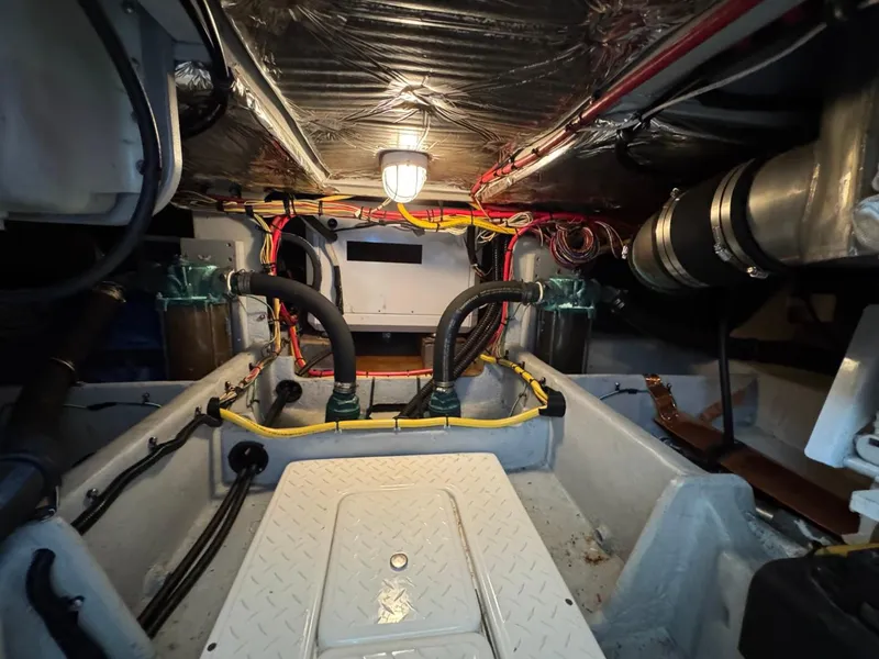 Slide: The Image of Engine room of 2003 Meridian 490 Pilothouse Motor Yacht with visible wiring and components. - 35