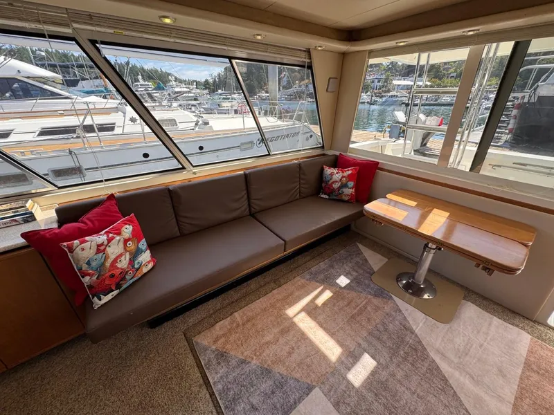Slide: The Image of Interior of 2003 Meridian 490 Pilothouse Motor Yacht with sofa and table. - 4