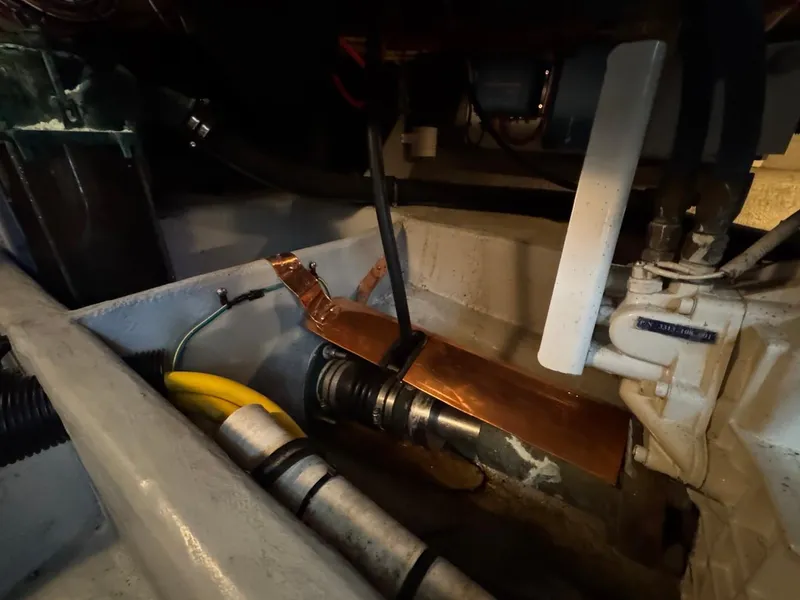 Slide: The Image of Engine compartment of 2003 Meridian 490 Pilothouse Motor Yacht, showing mechanical components and wiring. - 41