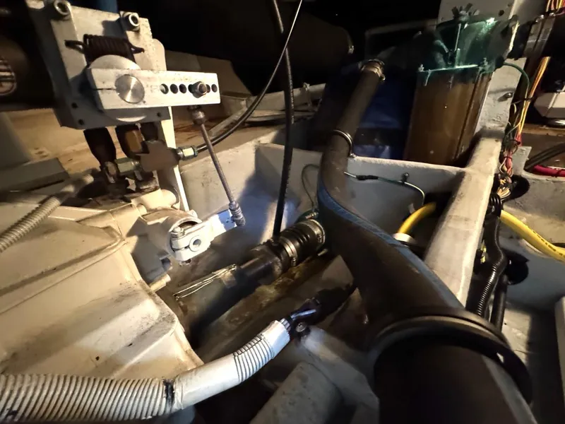 Slide: The Image of Engine room of 2003 Meridian 490 Pilothouse Motor Yacht, showcasing mechanical components and wiring. - 42