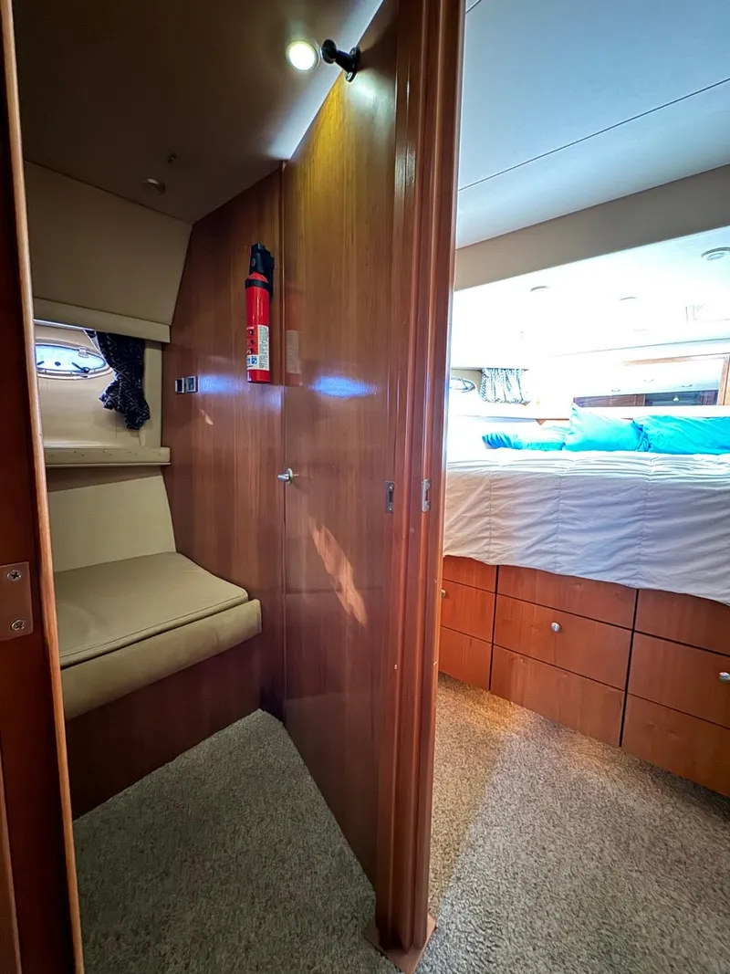 Slide: The Image of Interior of 2003 Meridian 490 Pilothouse Motor Yacht, featuring cozy cabin and bed. - 46