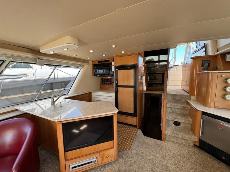 Slide: The Image of Luxurious interior of 2003 Meridian 490 Pilothouse Motor Yacht with modern kitchen amenities. - 5