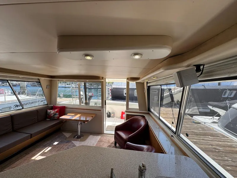 Slide: The Image of Interior of 2003 Meridian 490 Pilothouse Motor Yacht with seating and windows. - 8