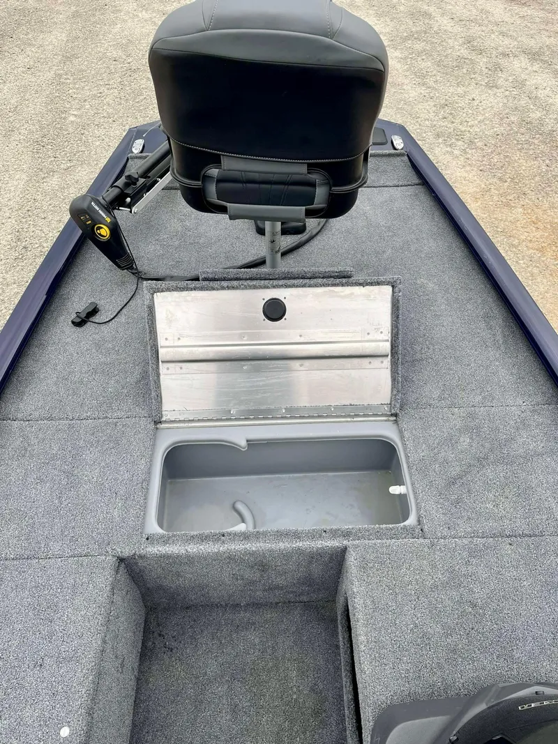 Slide: The Image of 2021 Tracker Pro 170 boat interior with storage compartment and seat. - 4