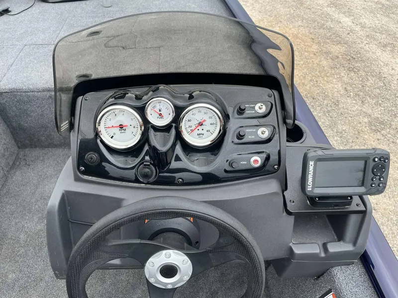 Slide: The Image of Dashboard of a 2021 Tracker Pro 170 boat with gauges and Lowrance device. - 5