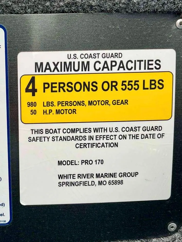 Slide: The Image of U.S. Coast Guard capacity label for 2021 Tracker Pro 170 boat, 4 persons or 555 lbs. - 7