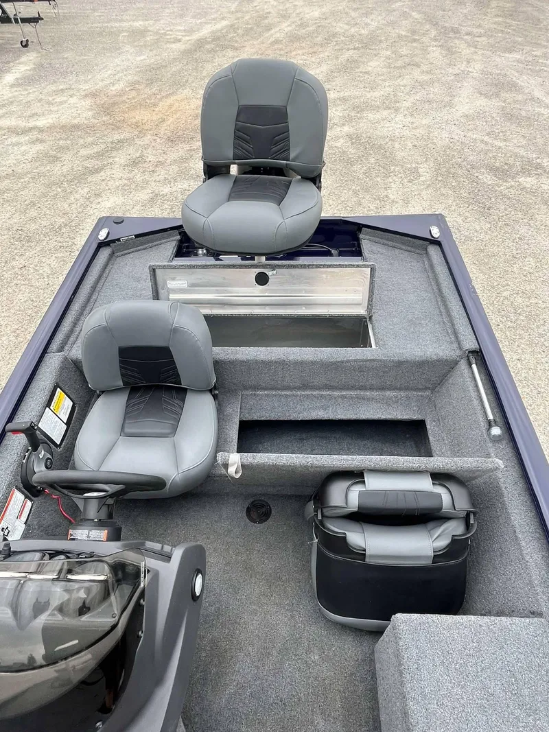 Slide: The Image of 2021 Tracker Pro 170 boat interior with two seats and storage compartments. - 8