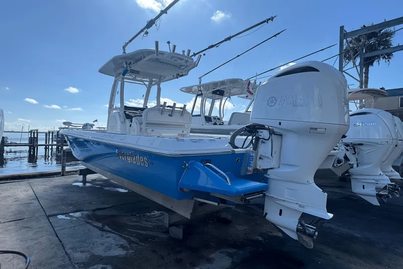 Slide: The Image of 2021 Everglades 243 CC boat with Yamaha engine docked at marina. - 0
