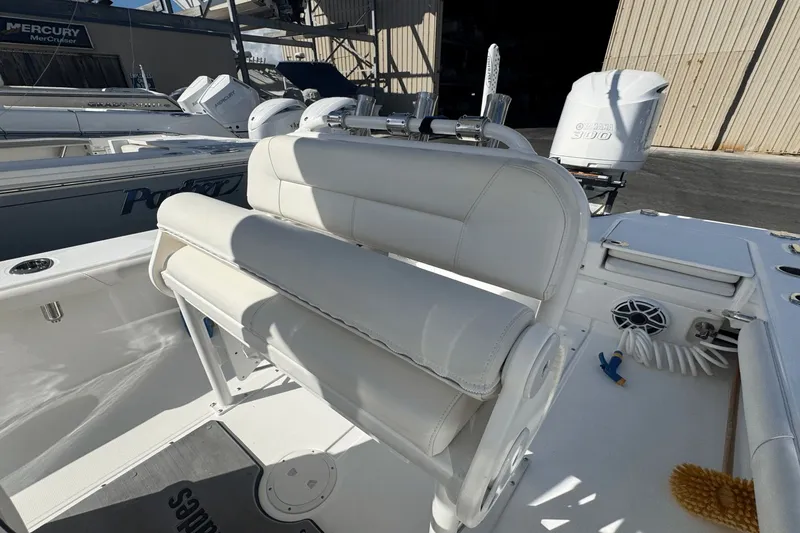Slide: The Image of 2021 Everglades 243 CC boat interior with white seating and Yamaha 300 engine. - 15
