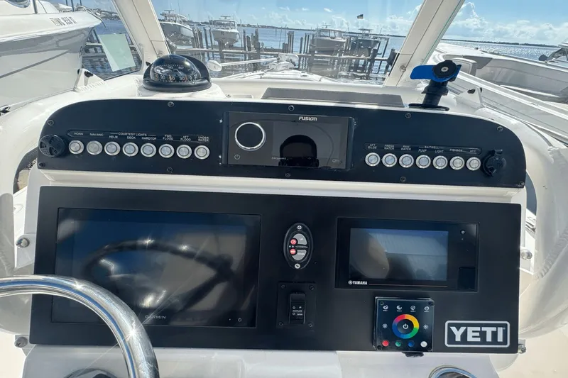 Slide: The Image of Control panel of a 2021 Everglades 243 CC boat with navigation and audio systems. - 29