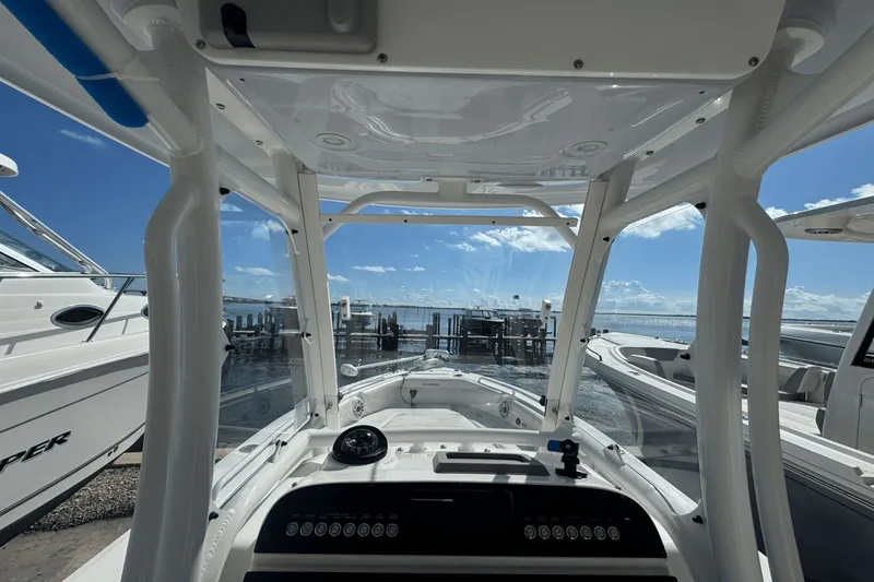 Slide: The Image of 2021 Everglades 243 CC boat interior with ocean view at marina. - 30