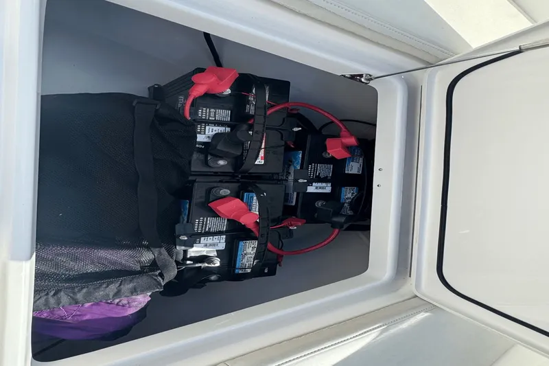 Slide: The Image of Batteries in storage compartment of 2021 Everglades 243 CC boat. - 32