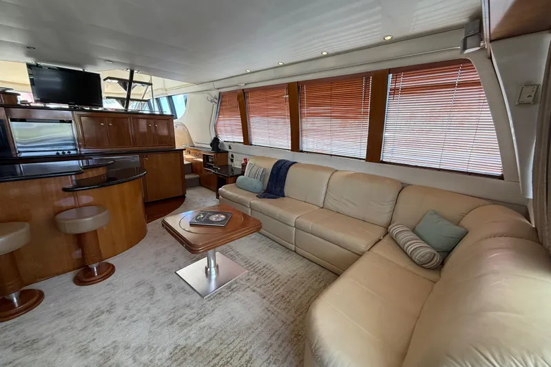 Slide: The Image of Luxurious interior of 2002 Carver 570 Voyager Pilothouse with leather seating and modern amenities. - 12