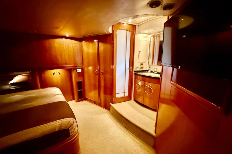 Slide: The Image of Luxurious interior of 2002 Carver 570 Voyager Pilothouse with wood finishes and elegant bathroom. - 19