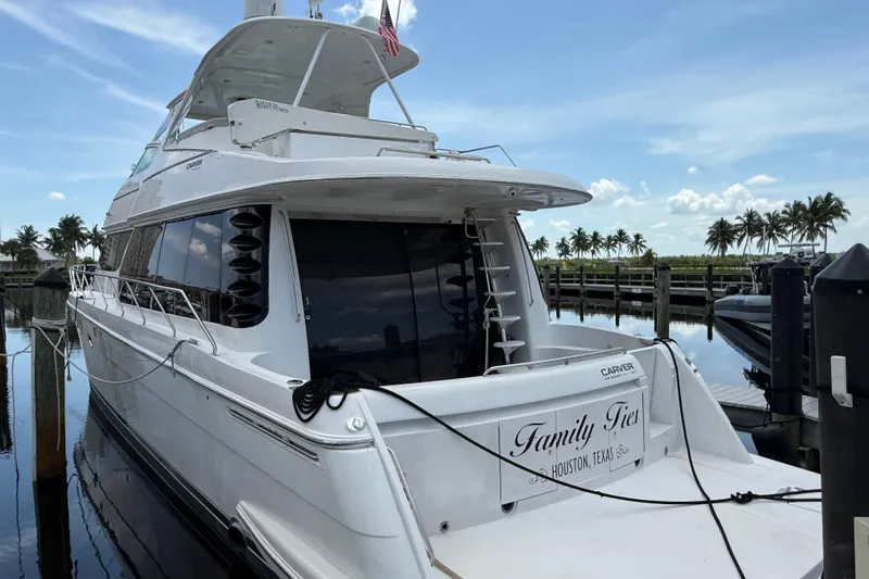 Slide: The Image of 2002 Carver 570 Voyager Pilothouse yacht docked, "Family Ties" from Houston, Texas. - 2