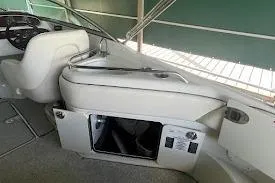 Slide: The Image of 2008 Sea Ray 240 Sundeck interior with open storage compartment. - 11