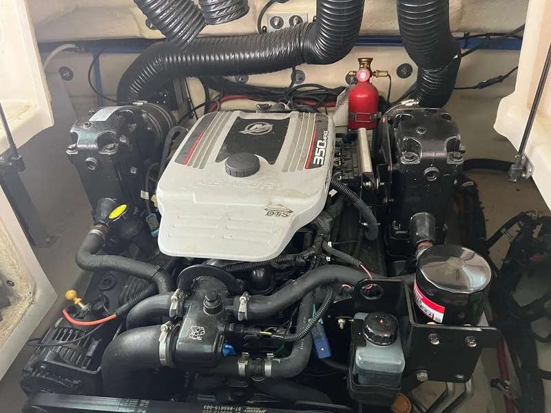 Slide: The Image of Engine compartment of a 2008 Sea Ray 240 Sundeck boat, featuring a MerCruiser 350 MAG engine. - 27