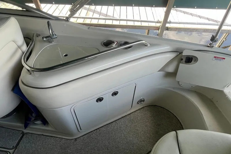 Slide: The Image of 2008 Sea Ray 240 Sundeck interior with sink and storage compartments. - 8