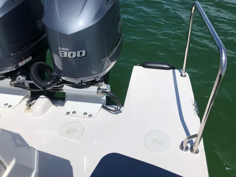 Slide: The Image of 2025 Cutwater C-32 Sedan with twin Yamaha 300 engines on a sunny day. - 12