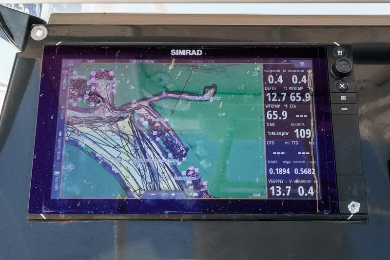 Slide: The Image of Simrad navigation display on 2019 Fountain 38 CC boat, showing detailed marine map and data. - 18
