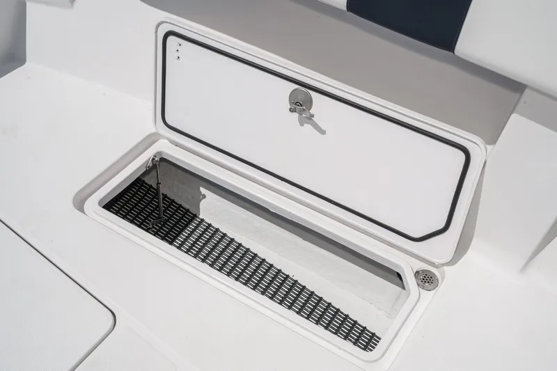 Slide: The Image of Storage compartment on a 2019 Fountain 38 CC boat, featuring a secure latch. - 40