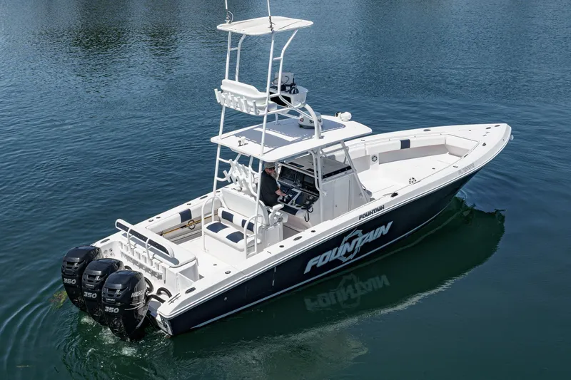 Slide: The Image of 2019 Fountain 38 CC boat with triple Mercury engines on calm water. - 5