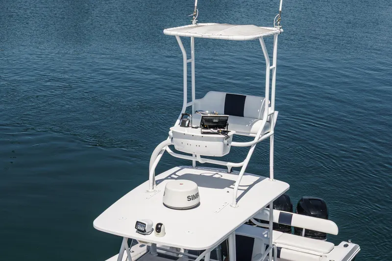 Slide: The Image of 2019 Fountain 38 CC boat with elevated helm station on calm water. - 7