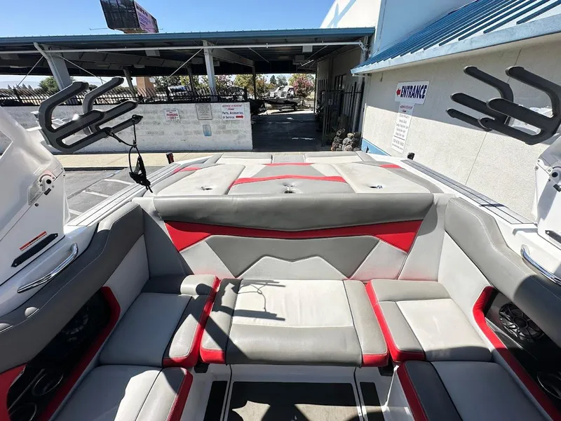 Slide: The Image of Interior of a 2021 Supreme ZS212 boat with gray and red seating. - 13
