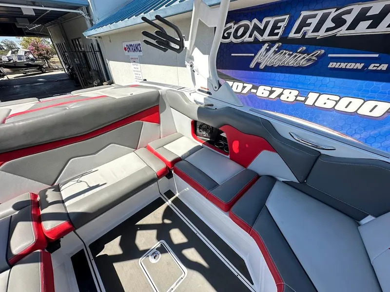 Slide: The Image of Interior of a 2021 Supreme ZS212 boat with gray and red seating. - 15