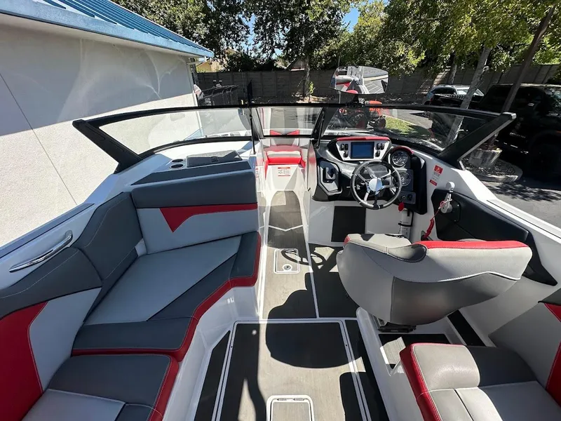 Slide: The Image of 2021 Supreme ZS212 boat interior with modern dashboard and seating. - 16